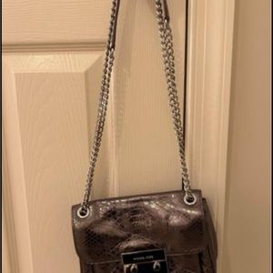 Michael Kors Gunmetal leather crossbody or you can double chain shoulder purse.